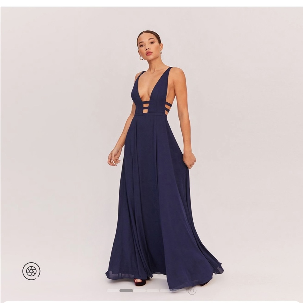 Fame and Partners The Liberty prom dress is a maxi featuring plunging neckline